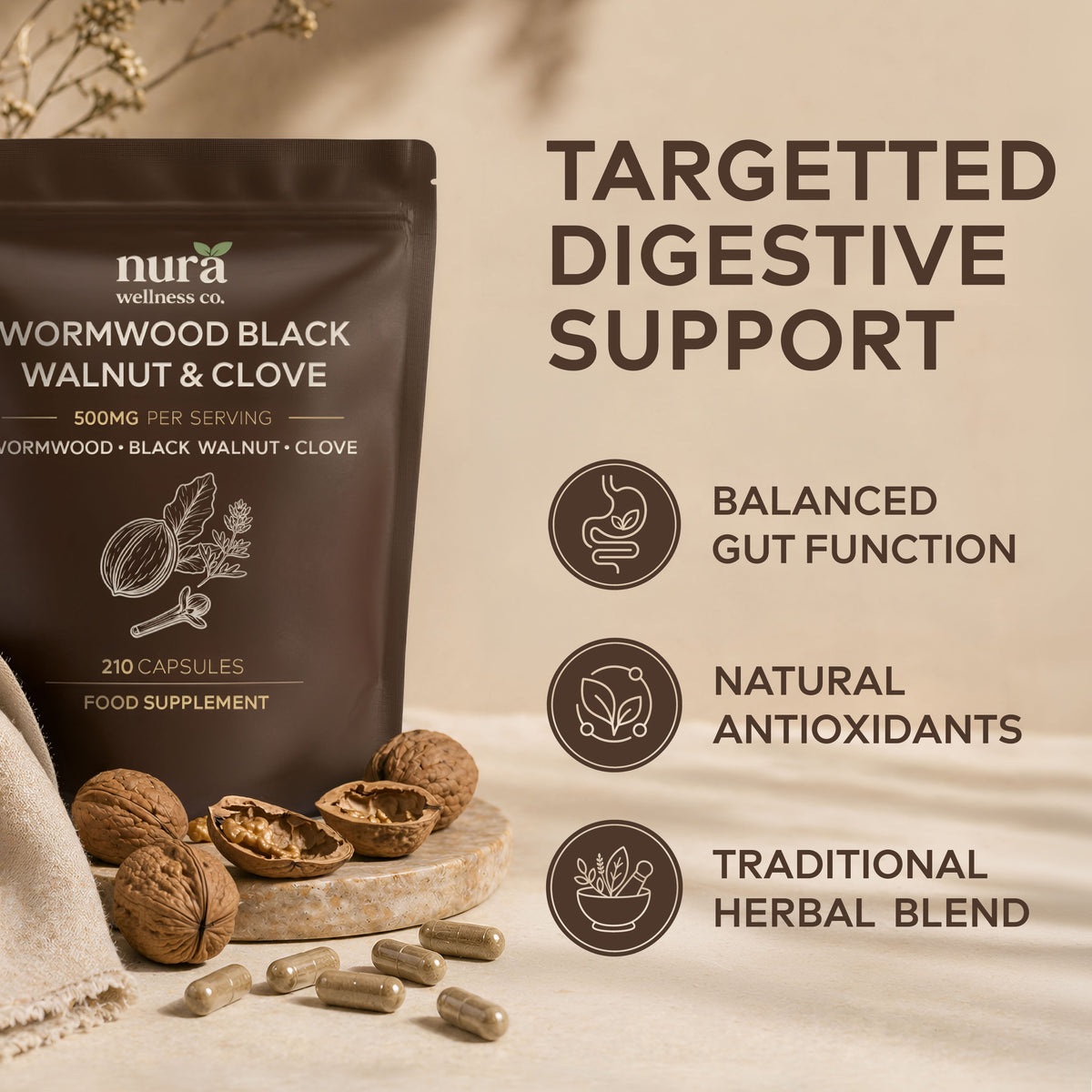 Nura Wormwood, Black Walnut & Clove pouch, 500mg per serving and 210 capsules, lying on a bed of whole walnuts and cloves